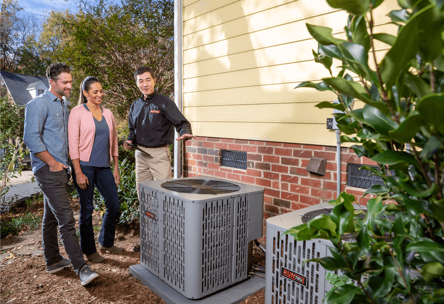 Family observing the repairs made to their outdoor A/C unit